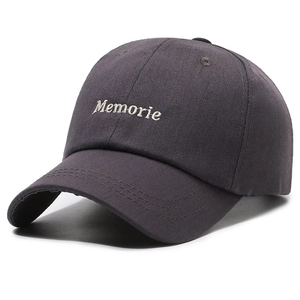 Dark grey charcoal baseball cap with white Memorie embroidery in a classic retro style
