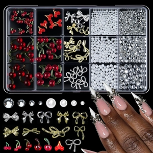 Close-up of 15-grid nail art set featuring 3D resin bows and red cherry charms