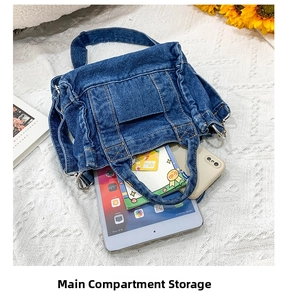 Detail view of spacious main compartment storage in a vintage navy denim tote bag