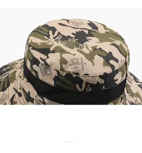 Close-up of breathable black mesh and camouflage fabric on outdoor sun fishing hat