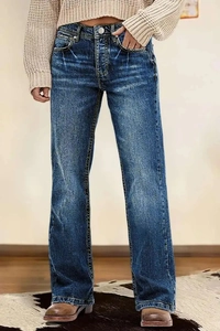 Detail van vintage high-waisted wide-leg jeans met donkere wassing en cat-whisker vervaging