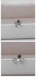 Detailed close-up of bow and heart stud earrings with sparkling zircon inlay