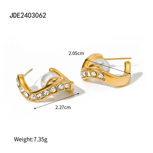 Detail of golden wave earrings with pearl and crystals including size measurements