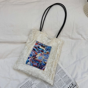 Detailed view of the hollow lace canvas tote bag with colorful abstract art print
