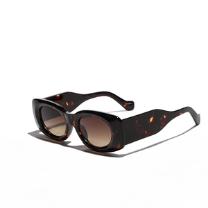 Vintage tortoiseshell square sunglasses with brown gradient lenses in a minimalist style