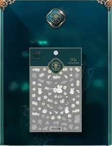 Detail of 5D nail stickers featuring white daisy flowers and cute pink bunnies TS609
