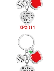 Detail of red apple teacher keychain with engraved heart thank you message and rhinestones