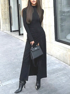 Slim fit black long sleeve high neck dress with side ruched details and a high slit