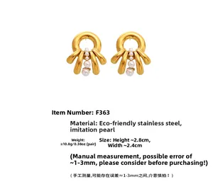 Detailed view of golden octopus pearl earrings with size dimensions and weight info