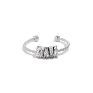 Macro detail of S925 sterling silver spinning ring featuring white zircon pave beads