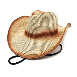 Macro detail of breathable gradient straw weave texture on a cowboy sun hat