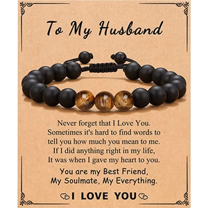 Detail of men's beaded bracelet with tiger eye stones on an emotional message card