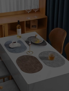 Macro detail of oval faux leather placemats with waterproof texture and heat resistance