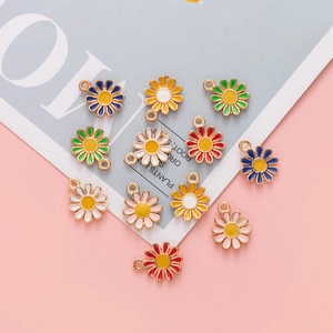 Close-up of colorful alloy daisy charms for DIY jewelry making in multiple vibrant shades