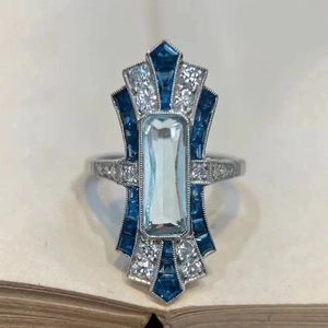Art Deco ocean style ring with rectangular blue gemstone and silver milgrain band