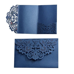 Navy blue laser-cut lace wedding invitation cards and envelopes with intricate hollow design