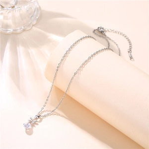 Close-up of 925 sterling silver dragonfly pendant with zircon stone and lobster clasp