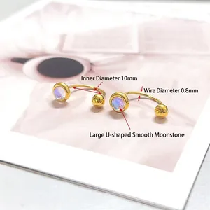 Golden U-shaped titanium earrings with iridescent moonstone and polished ball closure