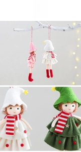 Detailed view of handmade Christmas plush dolls with striped scarves and hanging ropes