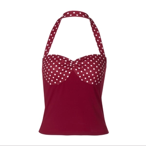 Detail of red and white polka dot halter neck top with sleek backless design