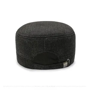 Detail view of winter wool cadet cap featuring adjustable metal buckle and warm fabric