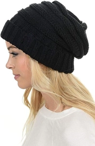 Detailed texture of black chunky knit beanie with cuffed design and warm cable weave
