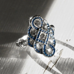Vintage Art Deco silver ring with blue stones and clear zircon in geometric hollow design