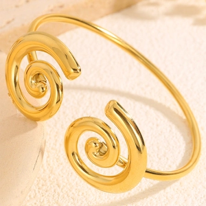 Golden titanium steel open bracelet with ancient Chinese spiral design and polished finish