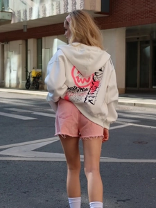 White street style oversized zip-up hoodie with pink graffiti print on the back