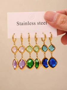 Close-up of six pairs of multicolor Czech glass earrings in a gold stainless steel set