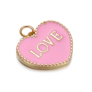 Close-up of pink enamel heart pendant with gold LOVE lettering and beaded trim