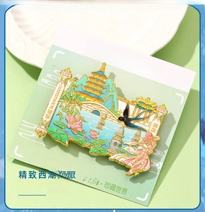 Detail of Hangzhou West Lake metal fridge magnet with 3D enamel finish and scenic motifs
