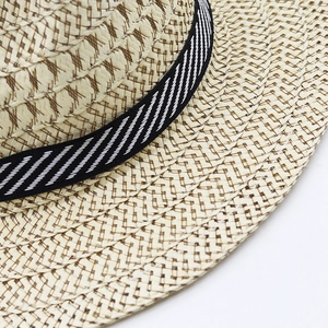 Classic men's woven straw hat for summer featuring a striped ribbon and breathable texture