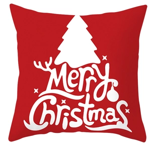 Detailed view of red Christmas pillowcase featuring white tree patterns and festive text