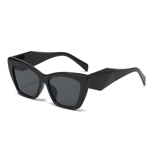 Chic black oversized cat-eye polygon sunglasses with dark lenses and geometric frame