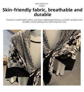 Detail of skin-friendly linen blend scarf with black and white floral pattern print