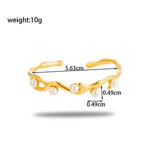 Irregular gold wave bangle with white pearls in stainless steel, 5.63cm diameter