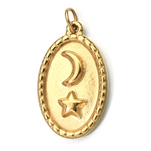 Detailed view of oval gold stainless steel pendant with moon and star engraving