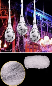 Detail of high-stretch white spider cotton webs and plastic spiders for Halloween decor