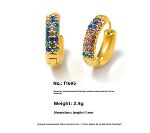 Detailed macro view of gold-plated stainless steel earrings with colorful zircon inlay