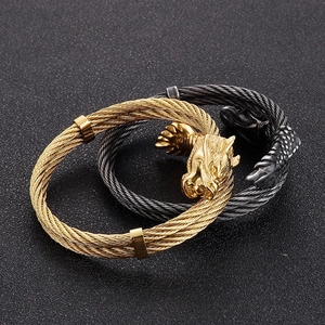 Punk dragon head bracelet in gold and black woven steel cable with metallic clasps