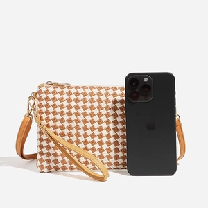 Brown and white checkered woven crossbody bag with leather wristlet and strap