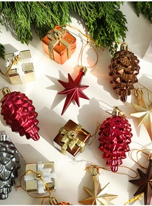 Close-up of glittery and metallic pine cones and star ornaments for Christmas tree decoration