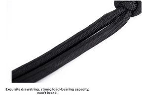 Macro shot of high-density black nylon drawstring with durable braided fiber texture