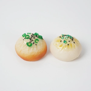 Realistic PVC steamed bun models with sesame and green onions set on white background