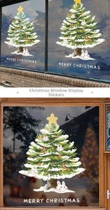 Detail of static Christmas tree window stickers with Merry Christmas text and rabbits