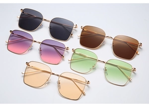 Flat lay of square metal sunglasses in five gradient colors on grey background