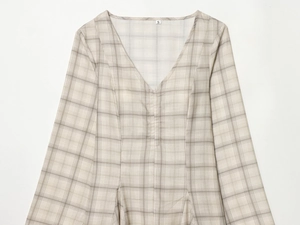 Detail of V-neckline and classic beige plaid pattern on a woven fabric dress, size S