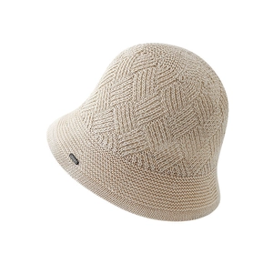 Minimalist beige knitted bucket hat with diamond texture and small label detail