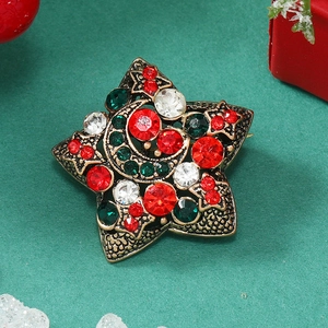 Star and crescent moon Christmas brooch with red and green crystals on retro bronze base